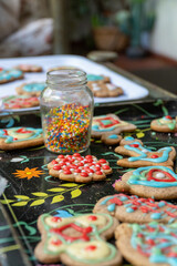 Homemade Christmas cookies being decorated with festive icing and sprinkles, capturing the holiday spirit with warm, cozy vibes.
