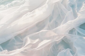 Obraz premium Close-up of delicate, flowing white fabric, creating a dreamy and airy visual effect.