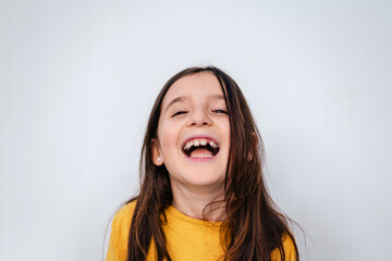 Joyful Child Laughing in Bright Yellow Top