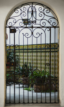 An ornate black wrought iron gate