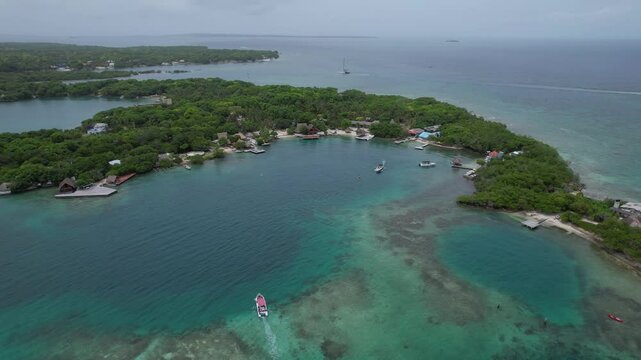 Cinematic aerial View of the beautiful Bora Bora island Beach and Resort in Cartagena.