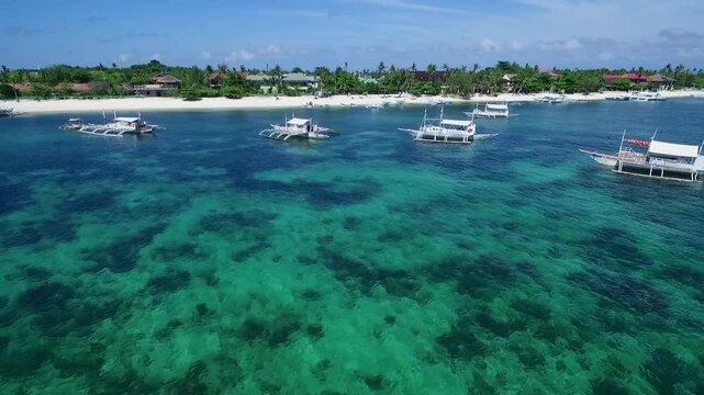 Boat in Bounty Beach and Malapascua Island Seashore in Cebu, Philippines. Sulu Sea and Beautiful Seascape in Background. Drone