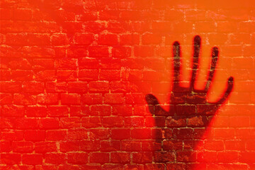 Human hand ghost in front of bricked wall teaxture