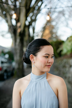 Elegant Woman Wearing Dangling Earrings
