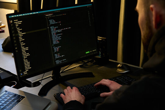 Programmer Working on Code - Powered by Adobe