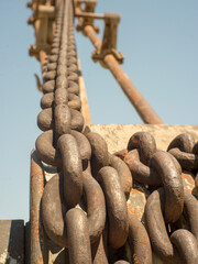 Very rusty articulated mechanical arm part and gear