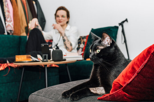 Relaxed Woman with Cat at Home