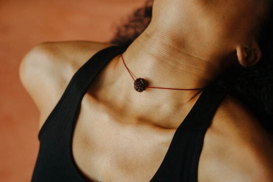A woman's throat with a necklace
