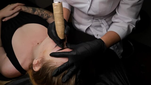 Macro shot of a girl's freshly tattooed brows as she lies on a treatment table. Permanent eyebrow makeup, performing eyebrow tattoo PMU