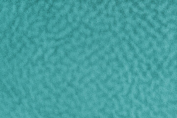 Faux fur texture with wavy effect, fluffy velours turquoise fabric or cloth, upholstery textile