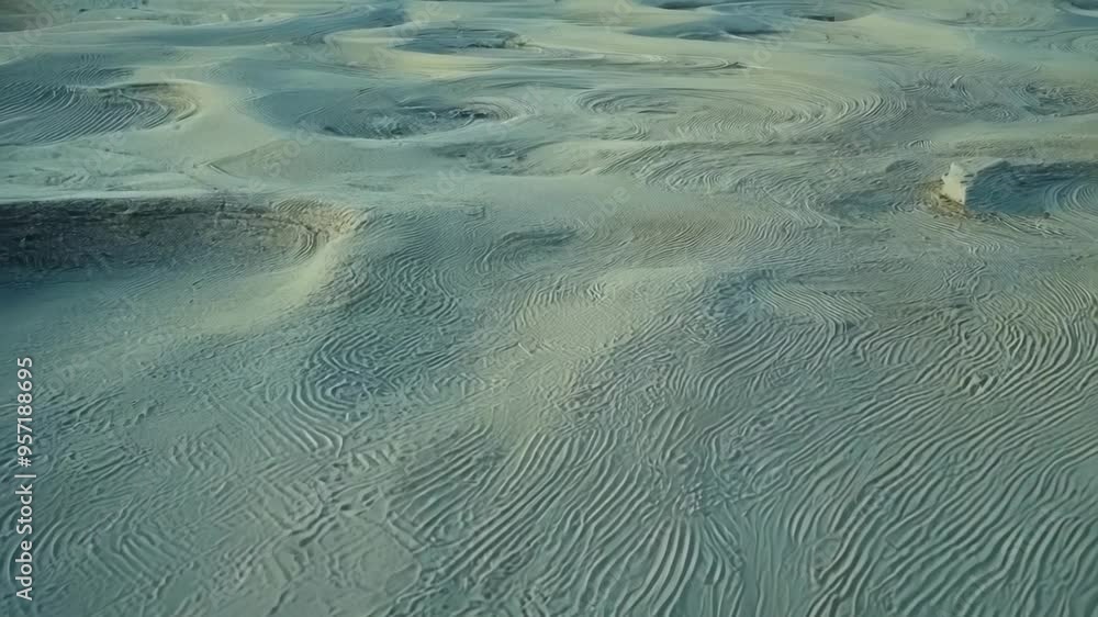 Poster mesmerizing turquoise sand patterns in surreal desert landscape, rippling and waving, shaped by wind