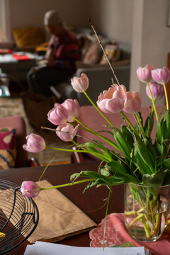 Pink tulip on the table candid moment at home