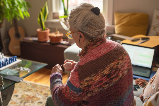 Anonymous moment at home knitting and technology
