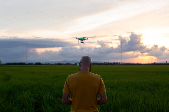 Man controlling the flight of a drone