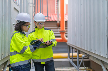 Maintenance technician at a heating plant,Petrochemical workers supervise the operation of gas and oil pipelines in the factory,Engineers put hearing protector At room with many pipes