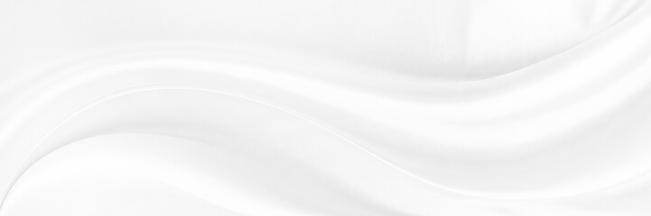 White gray satin texture that is white silver fabric silk panorama background with beautiful soft blur pattern natural.