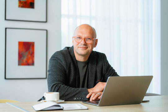 Portrait of a man in the office - Powered by Adobe