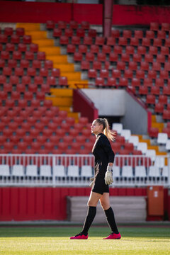 Woman Goalkeeper at the Stadium Field