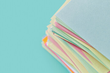 Cropped multicoloured office sticker papers laying in stock