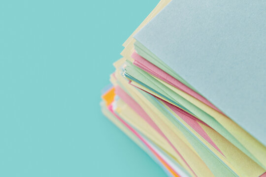 Cropped multicoloured office sticker papers laying in stock
