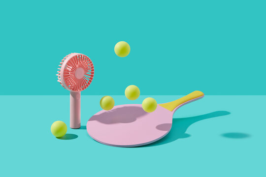 Pink fan pointed towards pickleball racket hitting five yellow balls