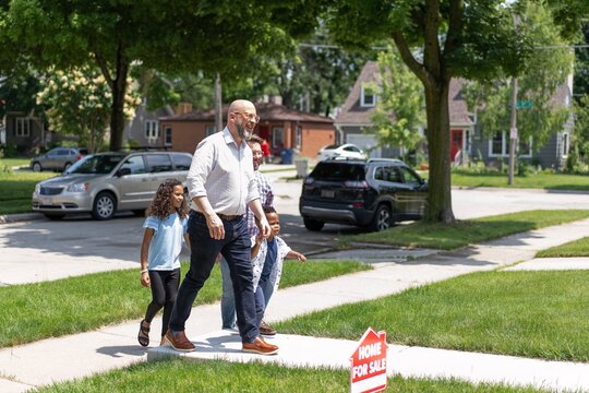 Family Walking Up to Home For Sale