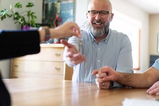 New Homeowner Receiving Keys with Joy