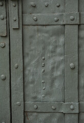 Weathered metal surface with visible rivets
