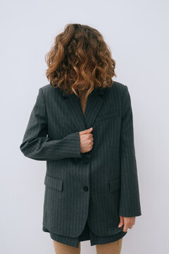 Anonymous woman in blazer hide face