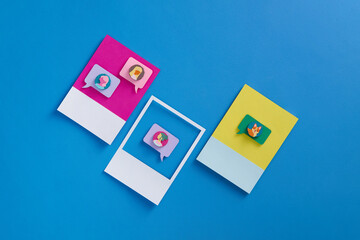 Paper cut style Smartphones with Flying Emoji Reactions.