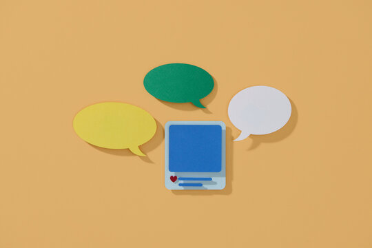 Colorful Speech Bubbles and Smartphone on Orange Background