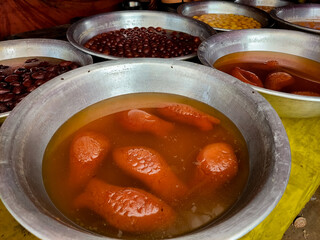 Homemade sweet in village fair which shape of fish in sugar juice