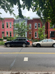 car in front of a house on a street in old town