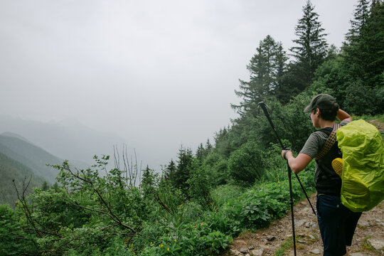 teen boy  hiking the Tour du Mont Blanc, in the  Swiss Alps, 