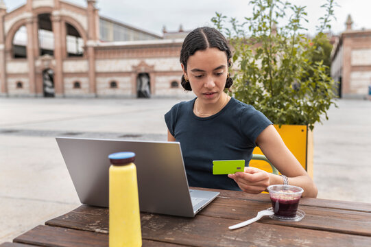 Freelance online banking with laptop and credit card