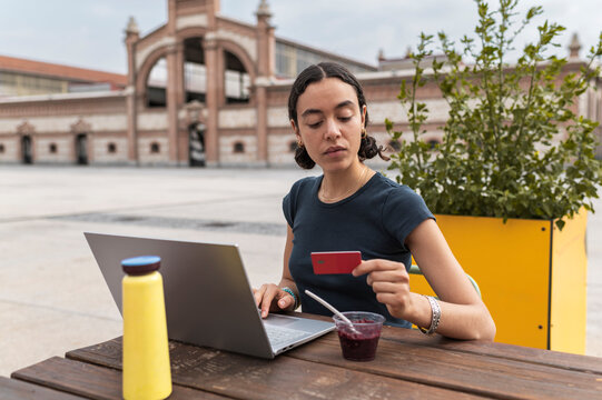 Freelance online banking with laptop and credit card