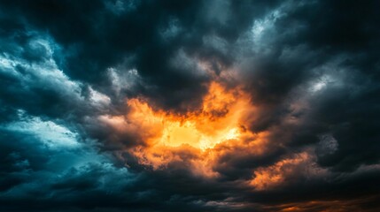 Fototapeta premium Dark clouds with the sun breaking through, stormy weather, dramatic lighting