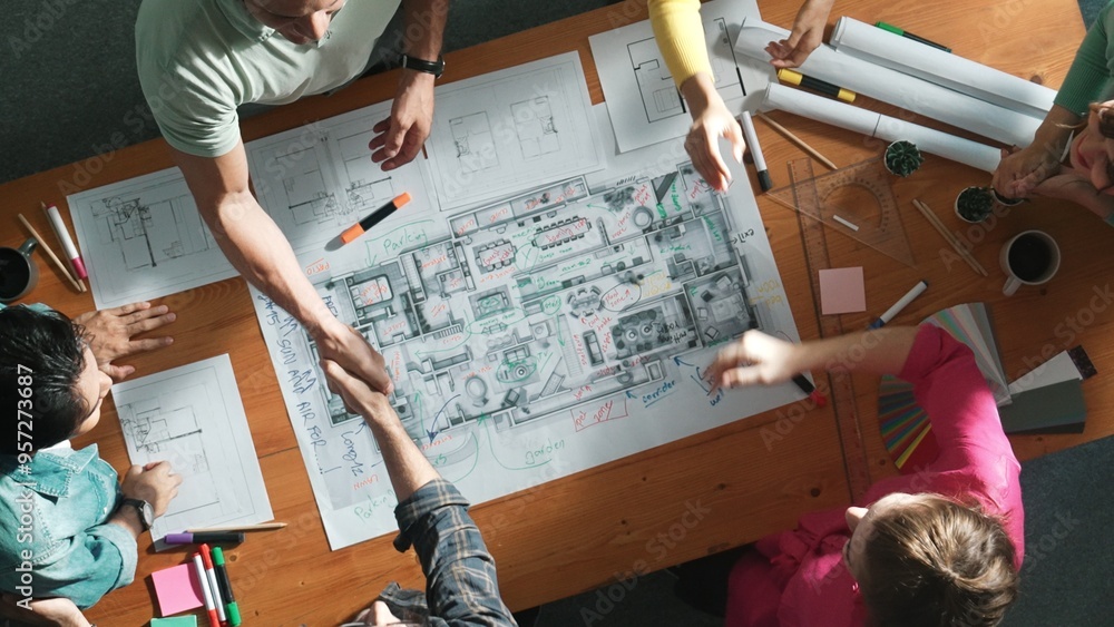 Poster top down view of smart business people shaking hands and making a contract. aerial view of architect
