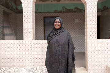 Senegalese woman smiling and posing in a building in africa