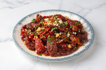 Traditional, delicious Turkish appetizers; Dried tomato appetizer salad with walnuts (Turkish name; Kurutulmus domates mezesi salatasi)