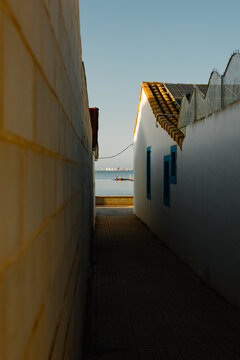 Dark alley in the streets of Murcia in the background La Manga.