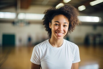 Portrait of a smiling teenage female African American basketball player