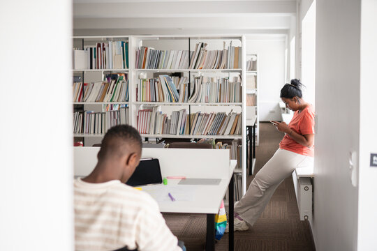 People in bright modern library