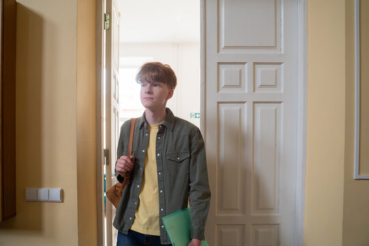 Student walking in university auditorium