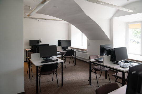 Workspace with computers on desks.