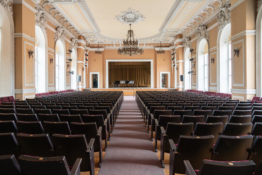 Spacious concert hall with many rows of seats