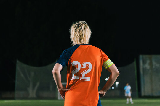 Football captain standing under the stadium lights.