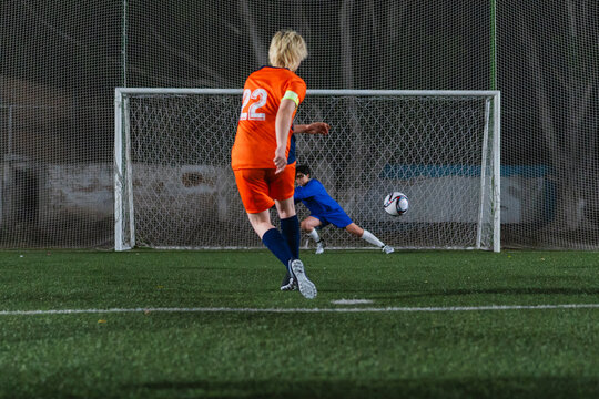Football player kicking a goal.