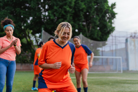 Football player practicing agility drills.