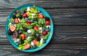 Berries salad (blueberry strawberry blackberry ) with cheese feta and balsamic sauce